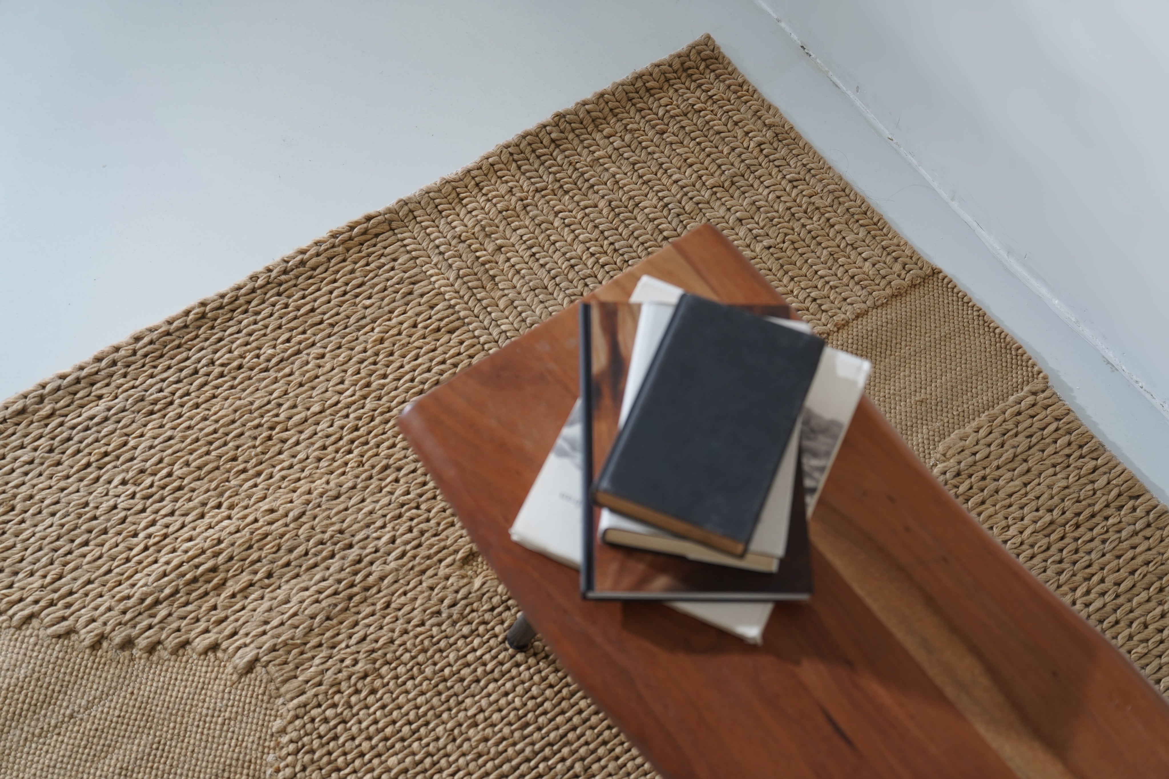 Close-up of the Terratwine Rug showcasing the diversity of textures from soft to rough, mimicking the surfaces found in nature.