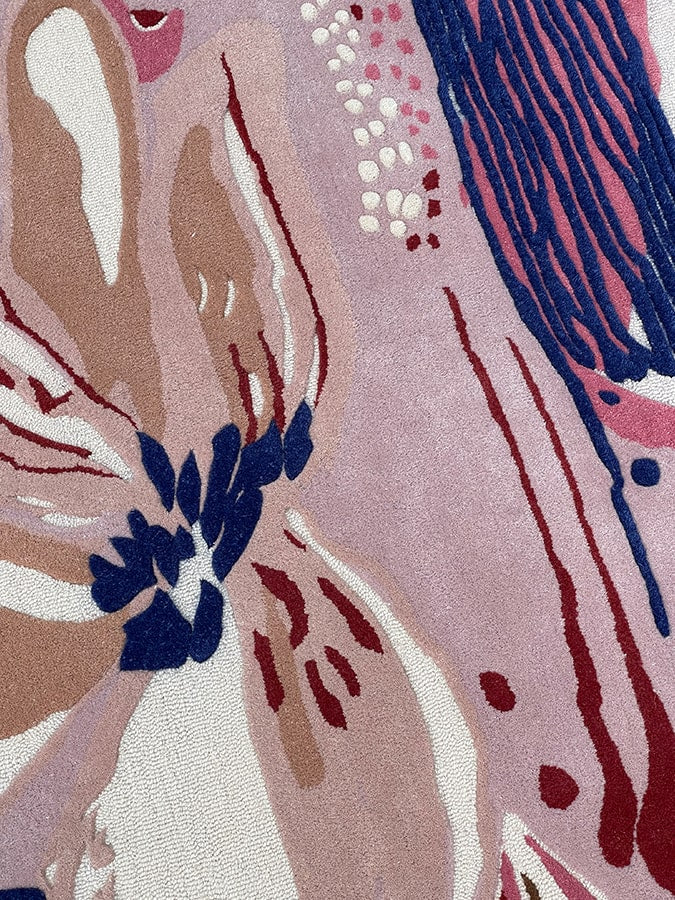 Close-up of the Bloom Rug's low pile texture, highlighting the quality and softness of the New Zealand wool.