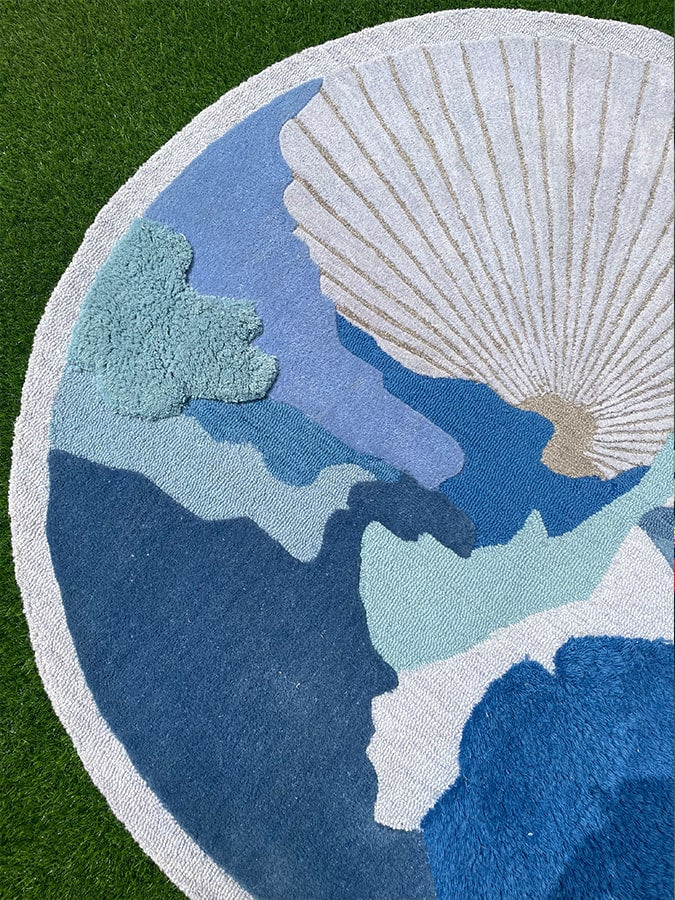Detail shot of the Cobalt Threads Rug, focusing on the multiple textures and depth, evoking the ever-changing surface of natural water bodies.