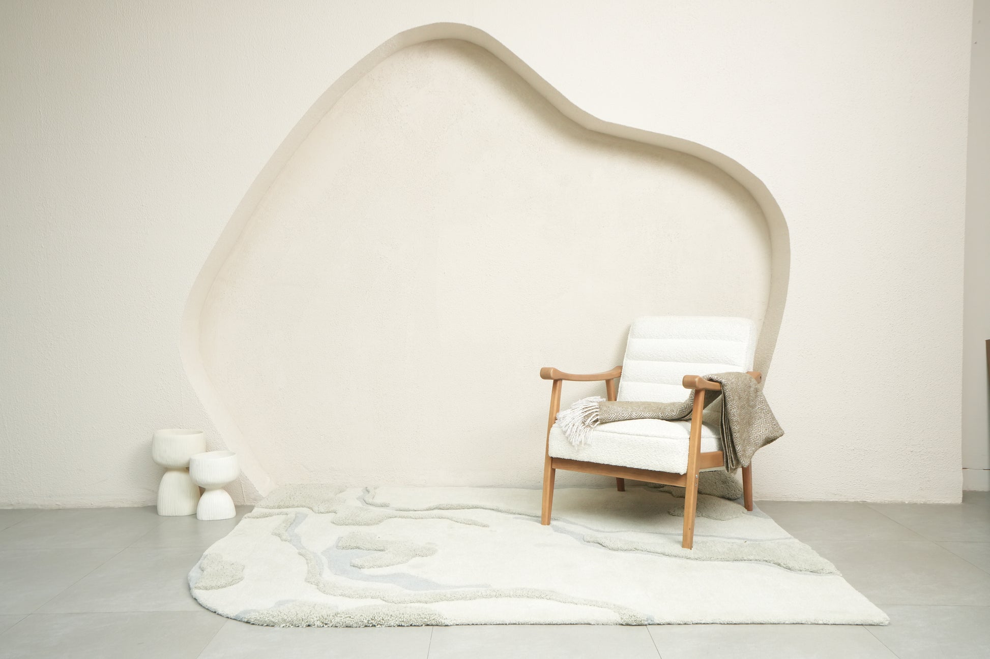 Dust Lake textured rug with soft grey tones and muted blue accents, inspired by calm waters
