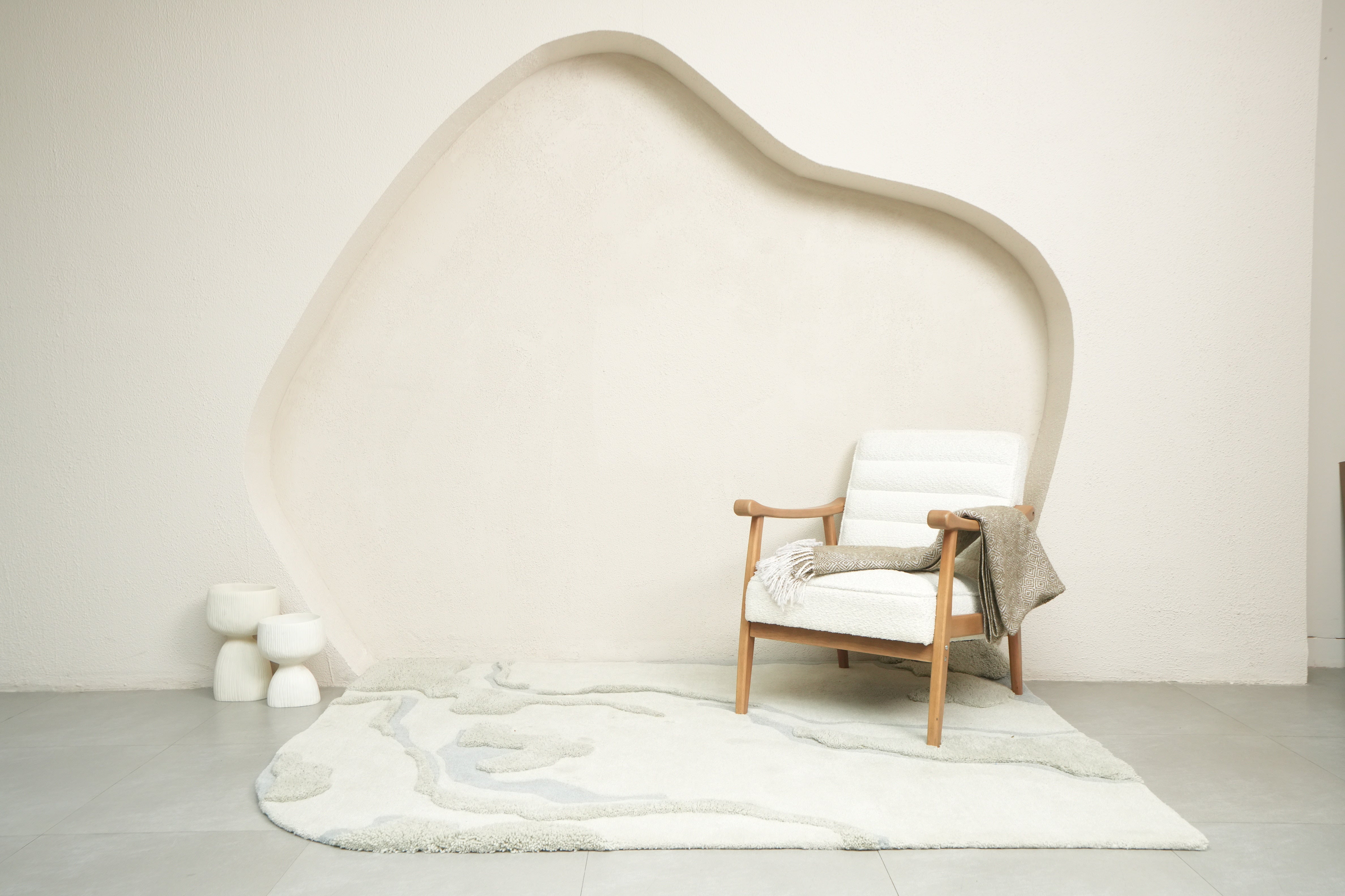 Dust Lake textured rug with soft grey tones and muted blue accents, inspired by calm waters