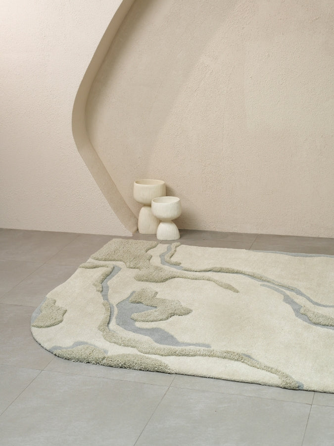 Close-up of Dust Lake hand-tufted rug showing high-low pile details and serene color palette.