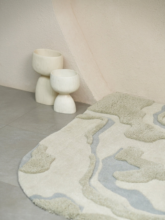 Close-up of Dust Lake hand-tufted rug showing high-low pile details and serene color palette.