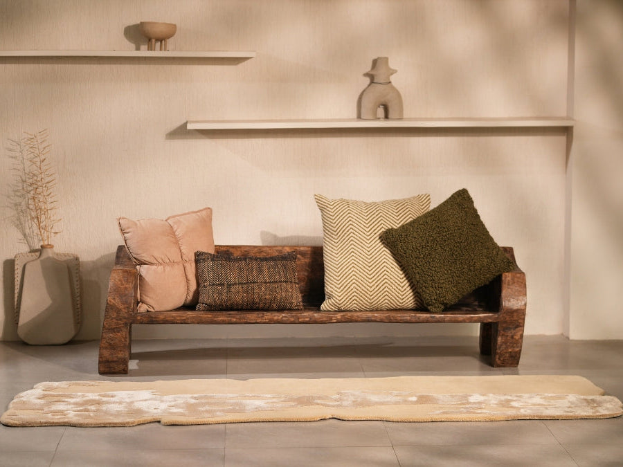 Field of Gold rug styled in a minimal living room with earthy accents.
