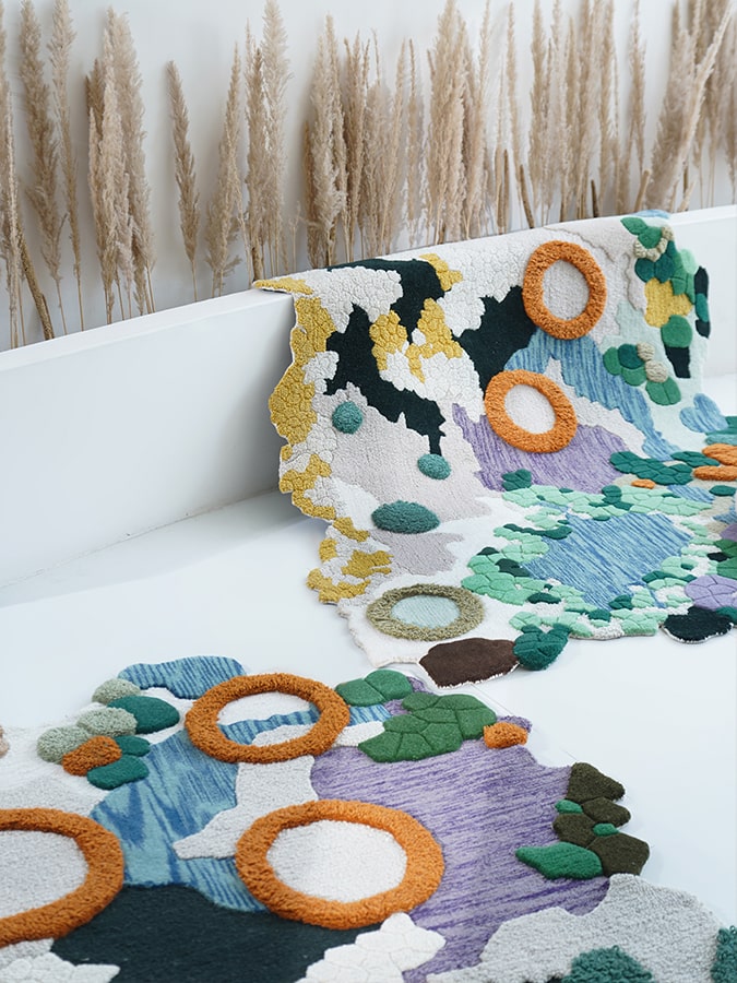 Detail shot of the Floral Fiesta Rug, focusing on the unique artistry and multiple textures that make it a functional work of art.