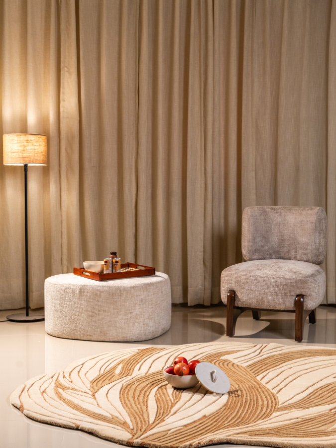 Golden Vein wool rug with flowing golden patterns styled in a contemporary living space.