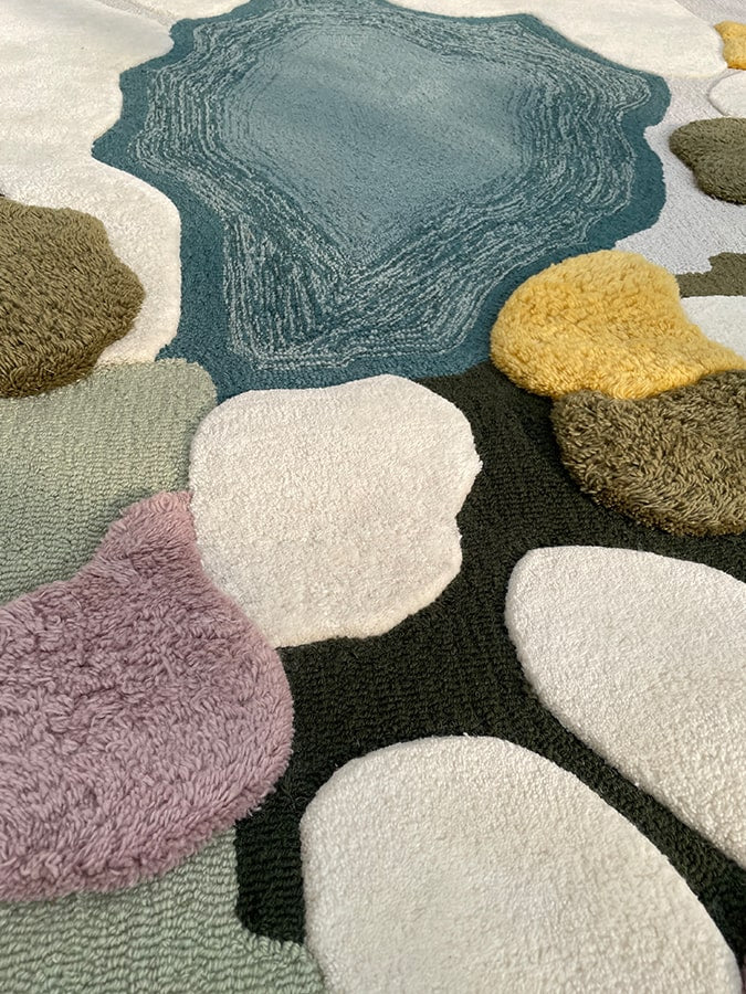 Close-up of the Natura Rug's luxurious New Zealand wool, highlighting the texture that mimics the natural world's calming essence.