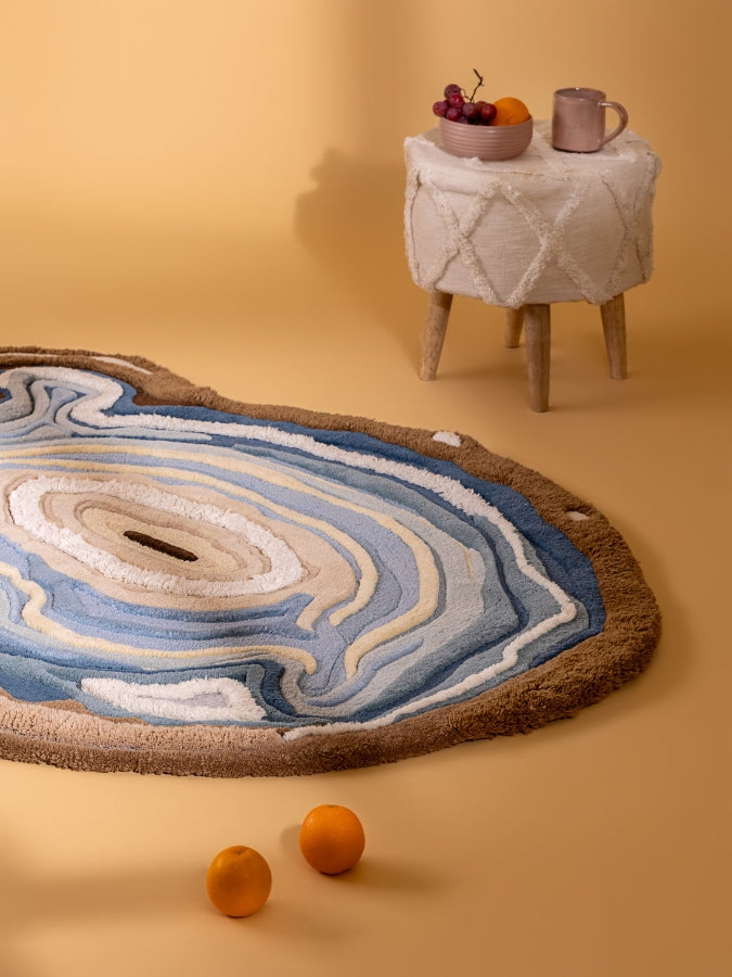 Ocean Eye rug styled in a serene space, adding coastal elegance and sculptural texture to modern interiors.