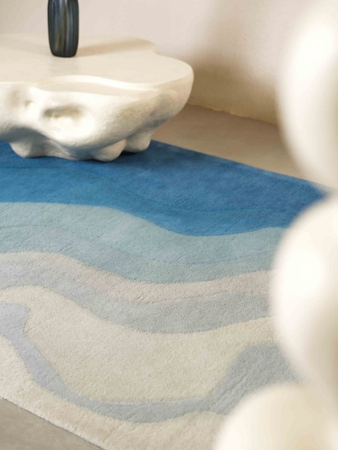 Facing the Sea rug evoking ocean waves in serene living space.