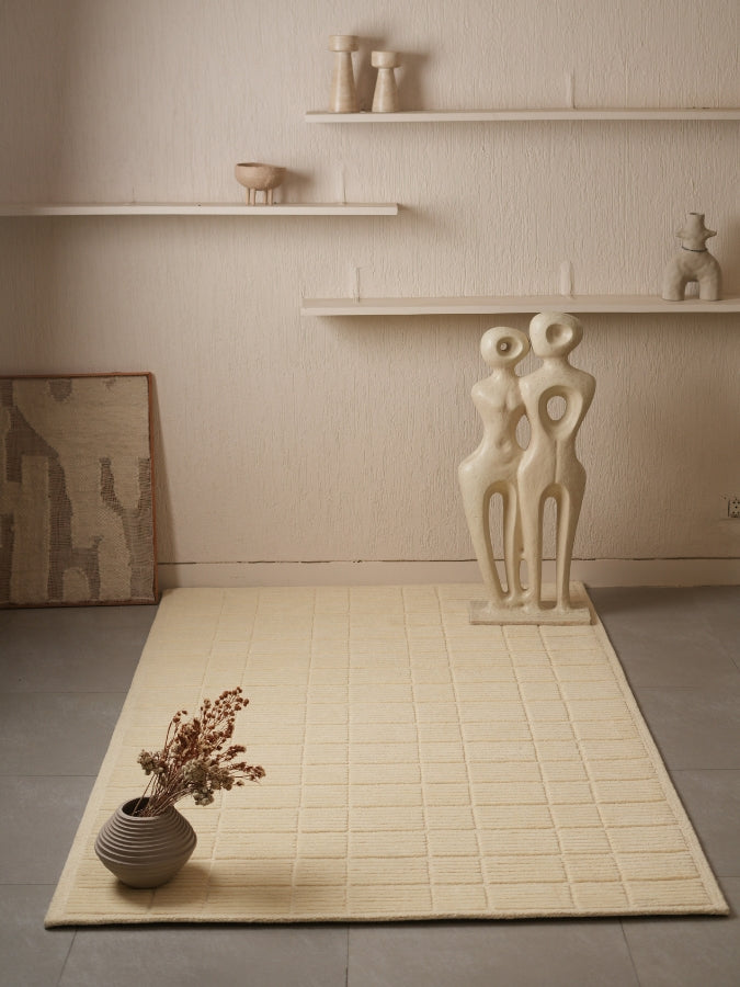 Soft Stone hand-tufted rug with minimal grid pattern and textured surface.