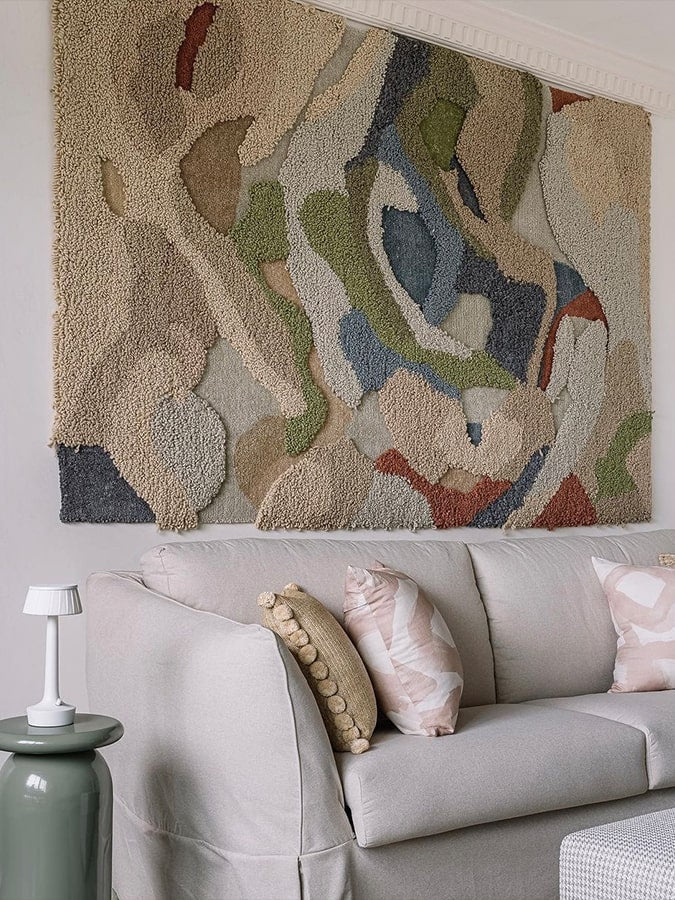 Terra Tapestry Rug displayed as textured wall art, showcasing the heavy loop pile that adds depth and a tactile experience.
