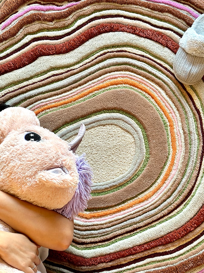 Close-up of the Timber Waves Rug, highlighting the intricate design and texture that evoke the serene essence of nature.