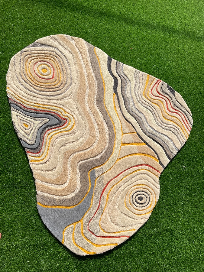 Uncanny Valley Rug inspired by sand ripples, showcasing its mixed wool texture that adds dynamic beauty to any room.