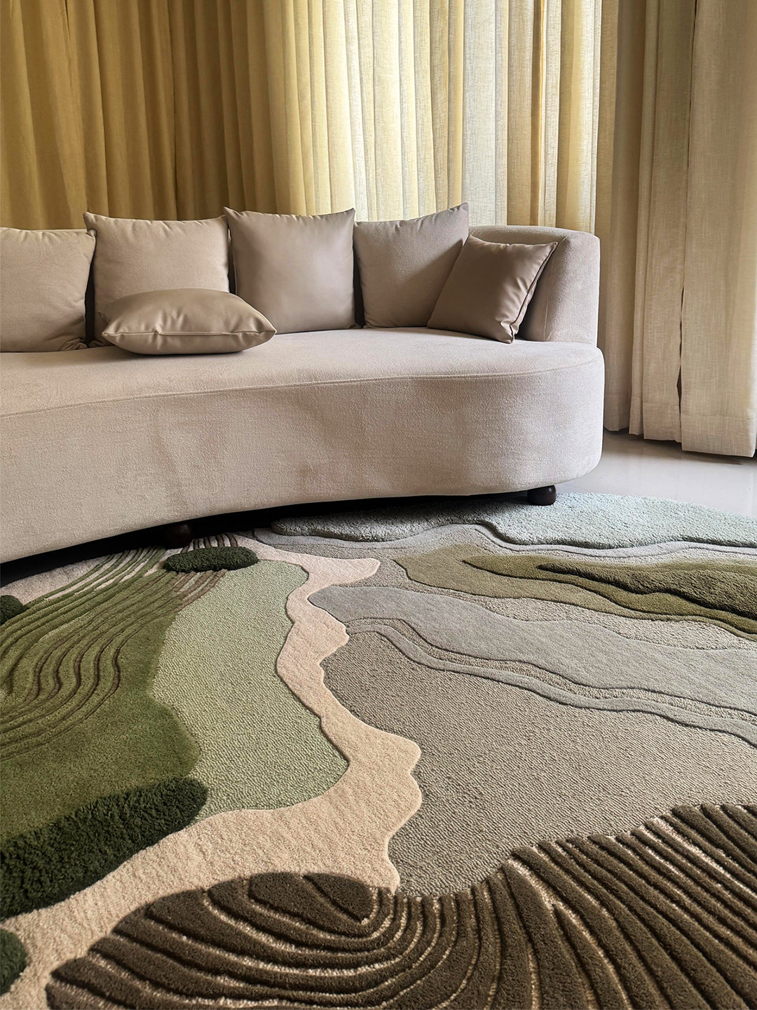 Alluvial Drift textured wool rug by Loops by LJ, with flowing river-inspired contours in moss green, blush and sand.