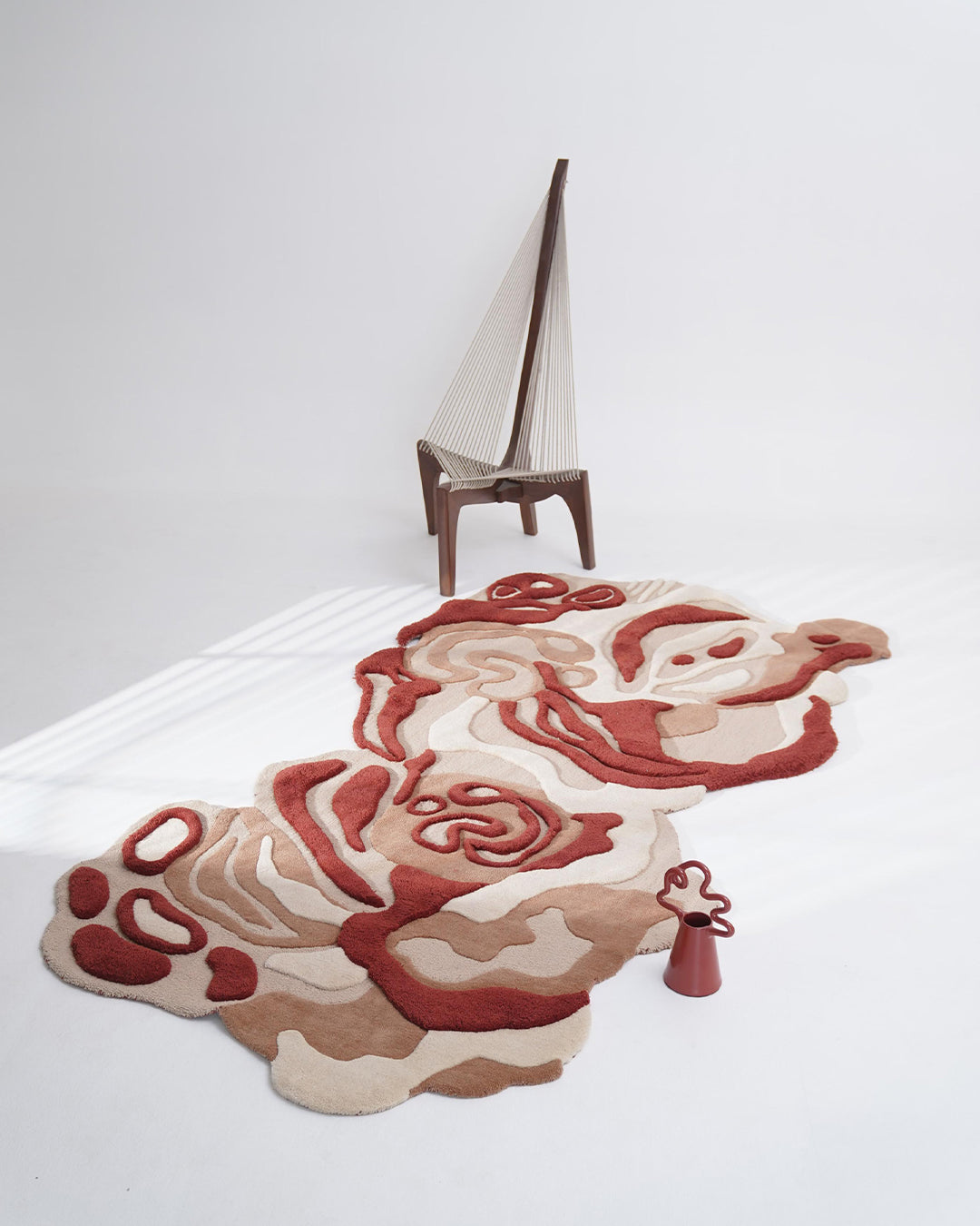 Burnt Horizon textured rug featuring warm and deep red tones, inspired by sunlit spice mounds.