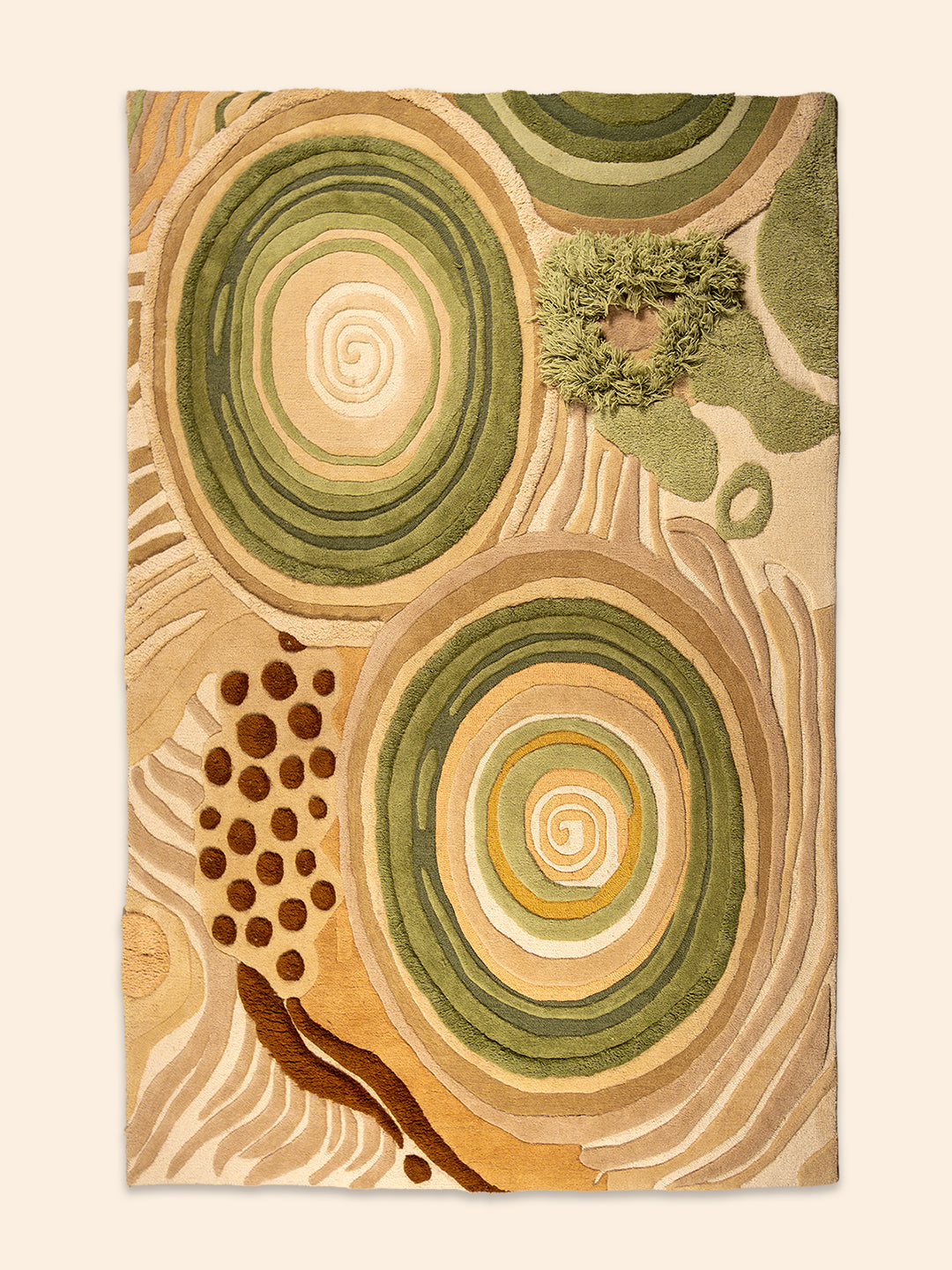 Overhead view of the Quiet Tide hand-tufted rug featuring spiral forms, sandy ridgelines, and rich earthy textures in New Zealand wool.