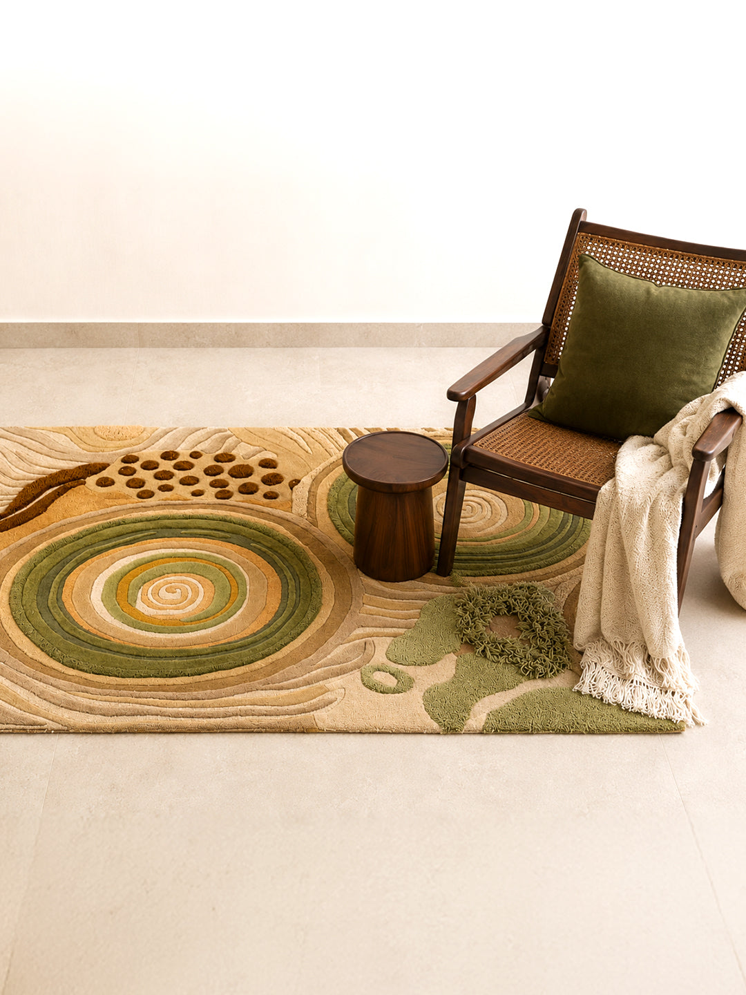 Quiet Tide hand-tufted rug with concentric sage, moss green, ochre, and blush patterns, crafted from 100% New Zealand wool