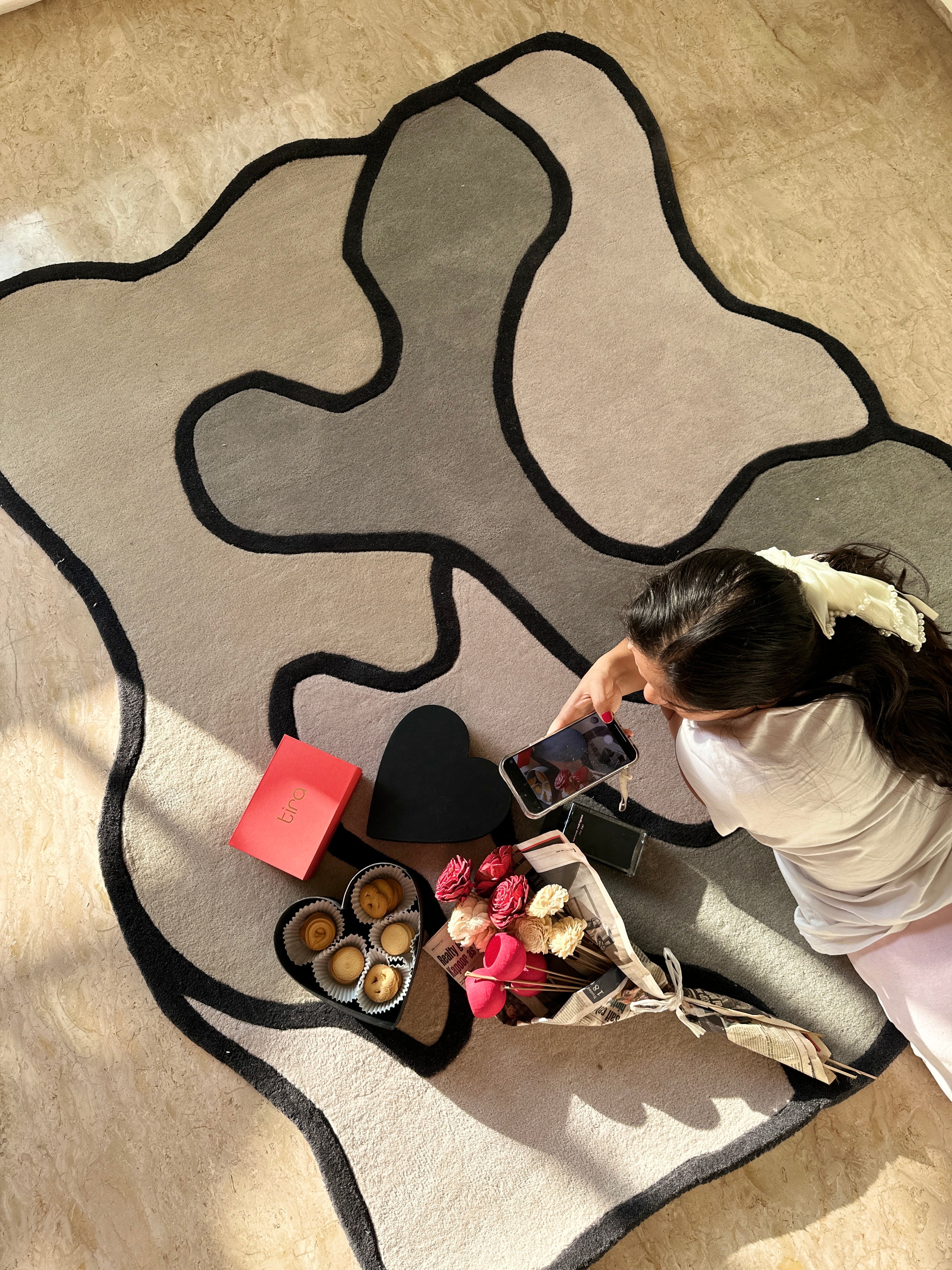 Shadowline Rug showcasing a striking black border with abstract shades of grey, hand-tufted from premium New Zealand wool.